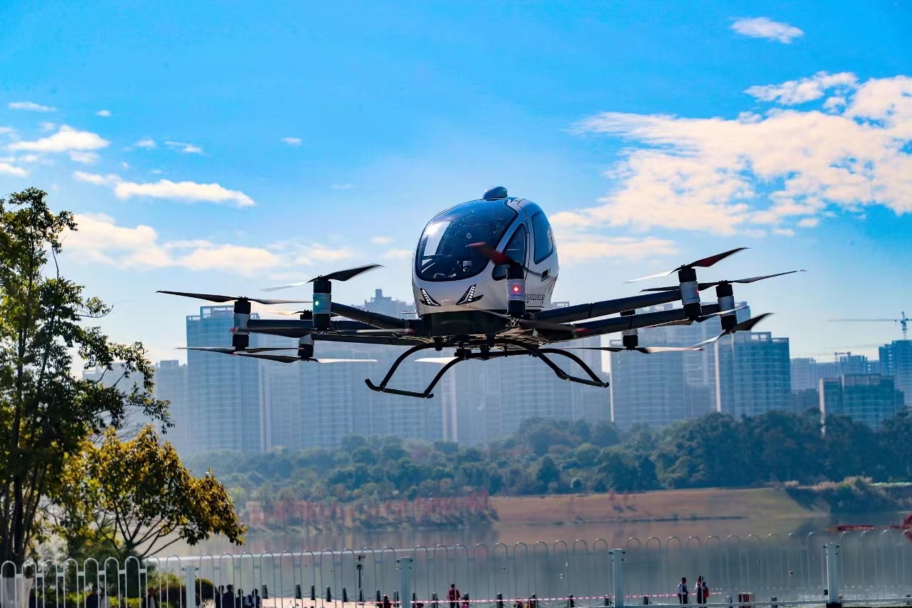 EH216-S passenger drone operational flight over modern cityscape